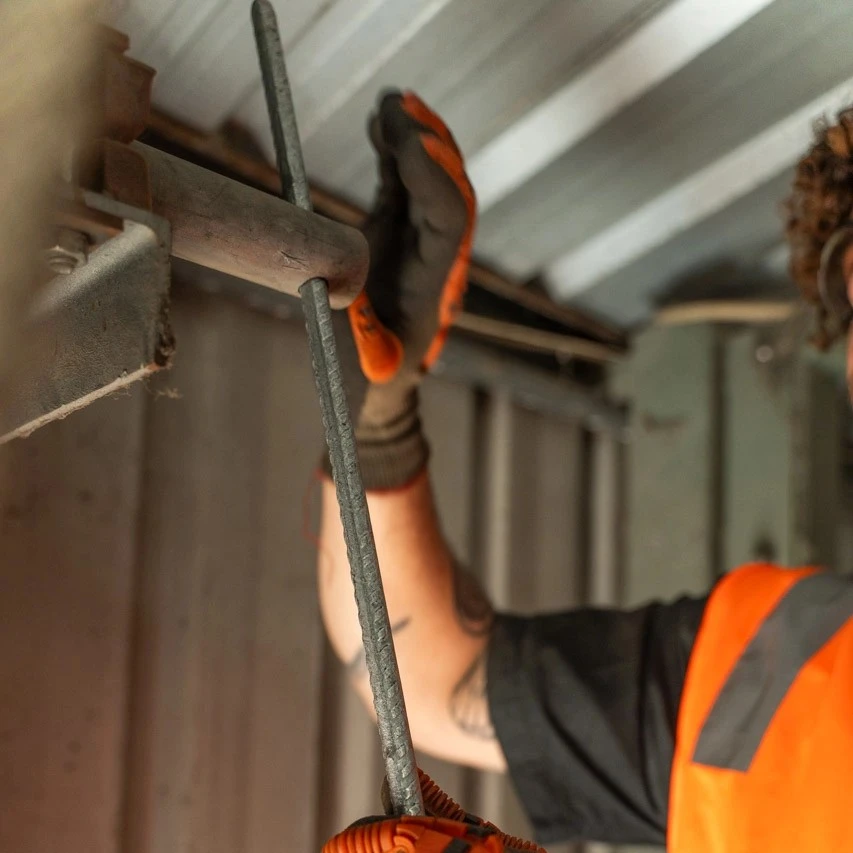 a-garage-door-technician-doing-preventative-maintenance-perth